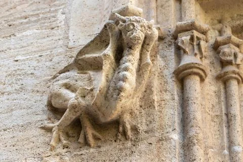 Gothic gargoyle bas relief on an ancient historical building in Valencia Foto stock