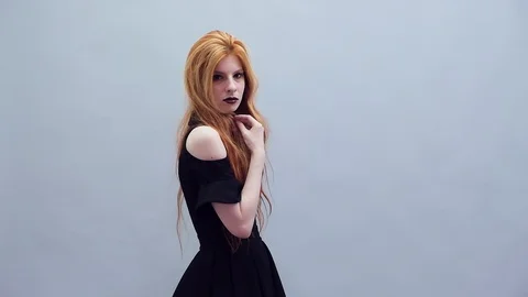 Gothic girl on grey background Stock Footage 116992284