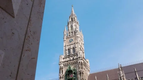 Gothic Munich Clock Tower Revealed Behind Modern Architectural Structure Stock Footage 340445717
