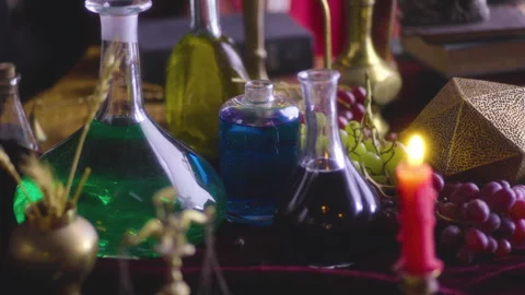 Gothic Renaissance Elixir: Assorted Bottles on a Table - Costume Drama Stock Footage 252582441