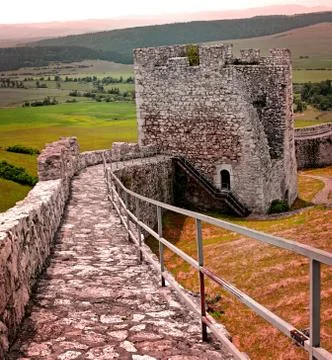 Gothic repaied stone castle tower and iron bainster. Stock Photos