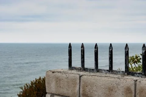 Gothic spikes closeup pointing to ocean horizon background Stock Photos