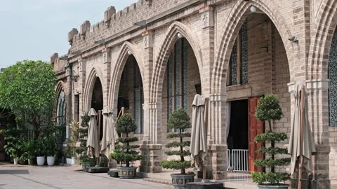 Gothic Stone Arches along the Exterior Facade of Nha Trang Cathedral Stock Footage 338404754