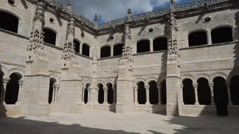 Gothic stone courtyard with intricate arches and windows, shot during Stock Footage 288003323