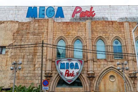 Gothic stone facade with arched windows in Mallorca 스톡 사진