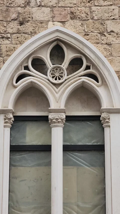 Gothic-style arched window on a building in Tripoli, Lebanon Stock Footage 314037277