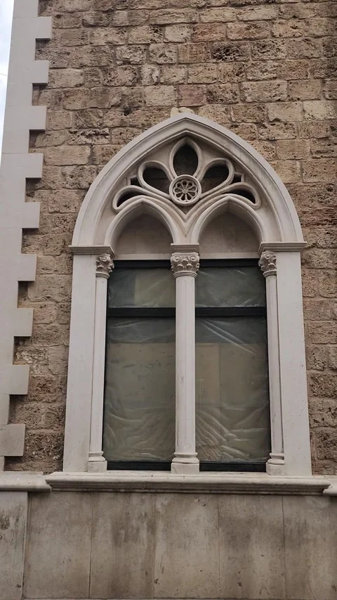 Gothic-style arched window on a building in Tripoli, Lebanon Stock-Footage 314037288