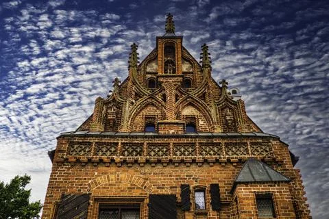 Gothic Style Architecture on the Cloudy Blue Sky Background Stock Photos