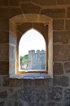 Gothic window on the inside of a tower of the Castelo de Sao Jorge Stock Photos
