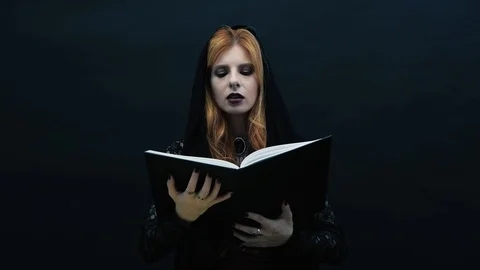 Gothic witch with book Stock Footage 117548213