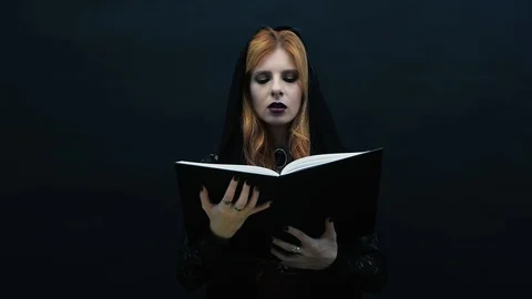 Gothic witch with book Stock Footage 117548488
