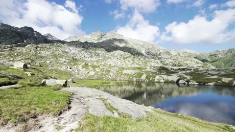 Gotthard pass mountains and lake Summer / Andermatt, Switzerland / 4k Stock Footage