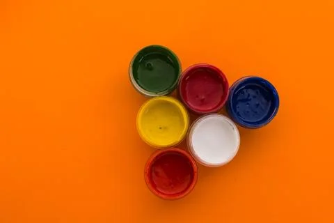 Gouache on an orange background Stock Photos