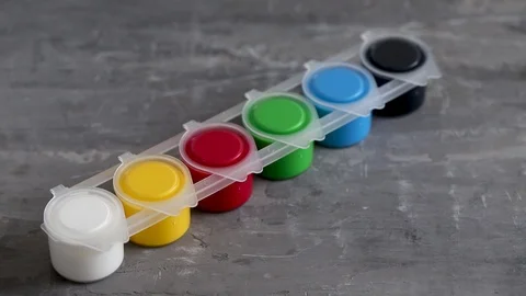 Gouache set in grey ceramic  background Stock Footage 125755543