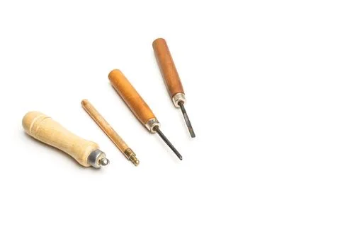 Gouges and punches for craftworking on a white background with copy space Stock Photos