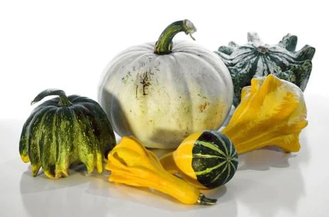 Gourds On A Shiny Surface Stock Photos