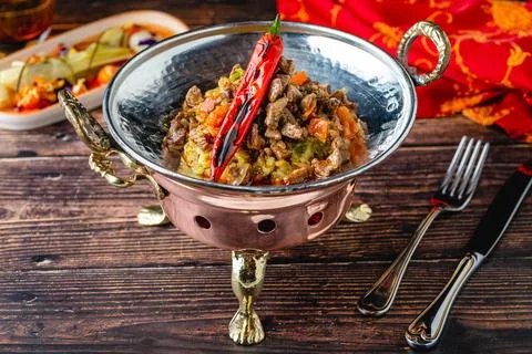 Gourmet beef dish with vegetables in rustic fine dining style Stock Photos
