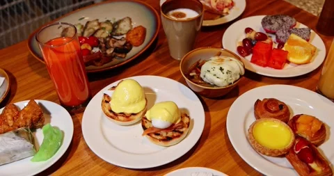 Gourmet Breakfast Spread Eggs Benedict Pastries Fruit Juice Hotel Stock Footage 329569045