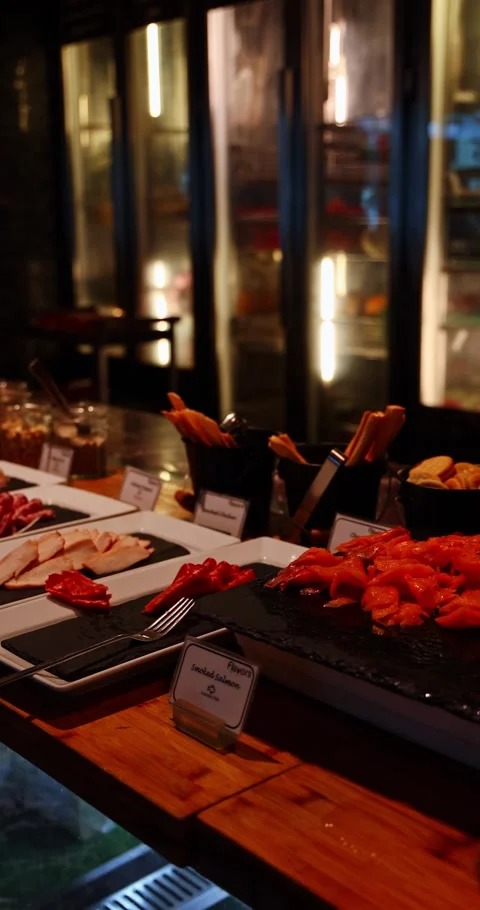 Gourmet Buffet Spread with Salmon and Chicken in Restaurant Видео 325091999