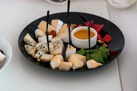 Gourmet Cheese Platter with Assorted Accompaniments Stock Photos