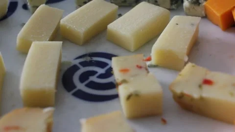 Gourmet Cheese Selection with Various Types Cut in Pieces on Plate Video stock 337140094