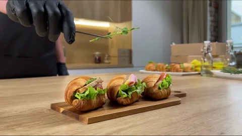 Gourmet Croissant Plating in Modern Kitchen Stock Footage 256972708