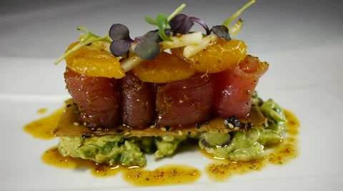 Gourmet dish luxury fine dining  restaurant food raw tuna avocado fine dining Stock Footage
