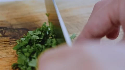 Gourmet finished meal angle: adding walnuts and spices to the sauce Stock Footage 342200984