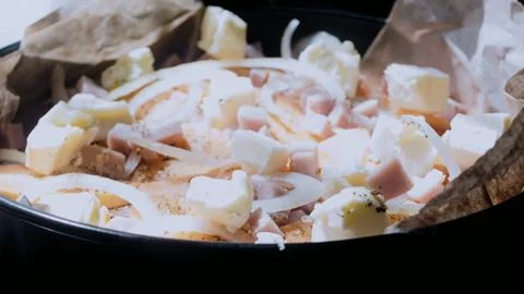 Gourmet overhead composition: arranging the mixture in a baking dish Stock Photos