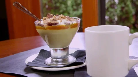 Gourmet Pudding with Steaming Coffee Stock-Footage 75761670