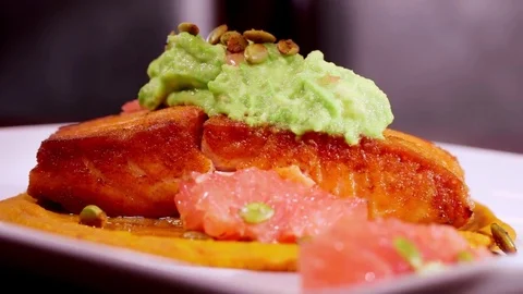 Gourmet Salmon Dish sliding onto the table Stock Footage 75753947