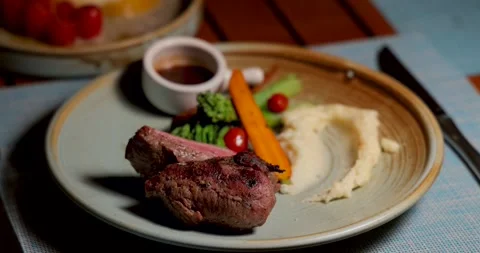 Gourmet steak dinner plate with mashed potatoes, carrots, broccoli, Stock Footage 312001714