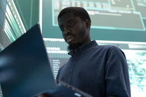 Governmental hacker exploiting server systems in high tech operations center Foto stock