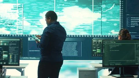 Governmental hackers exploiting network systems in high tech office 스톡 사진