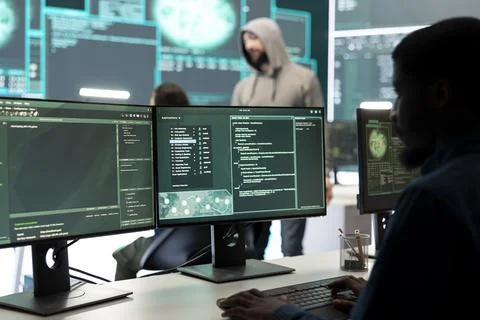 Governmental hackers team securing computer systems from cyber threats Stock Photos