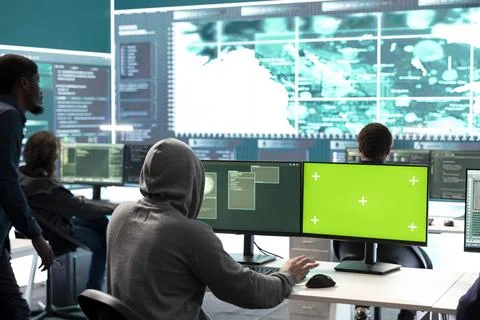 Governmental hackers using green screen in performing cyber security monitoring Stock Photos