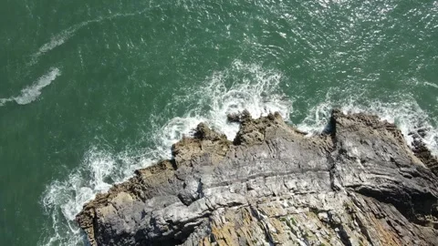 Gower cliffs DRONE looking down on sea Stock Footage 241483741