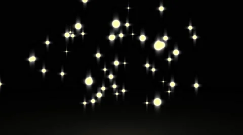 Gowing star particle in random direction with bounce on spotlight ground abst Stock Footage 65767761