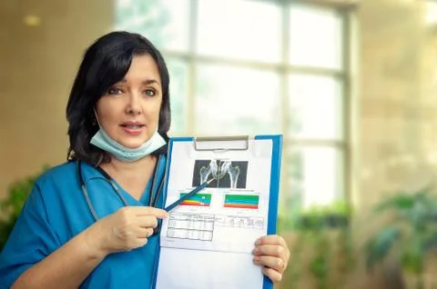 GP describes why to do a bone mineral density (BMD) test. Stock Photos