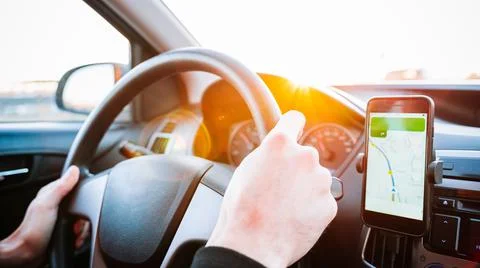 Gps car map system. Global positioning system on smartphone screen in auto ca Stock Photos
