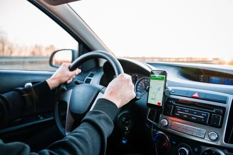 Gps device map system. Global positioning system on smartphone screen in auto Stock Photos
