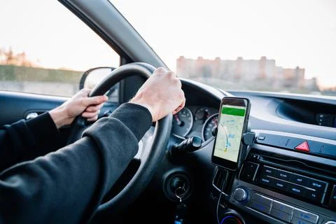 Gps device map system. Global positioning system on smartphone screen in auto Stock Photos