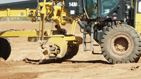 GPS, Laser guided Crawler Tractor shoveling dirt to grade the ground Stock Footage 217543289