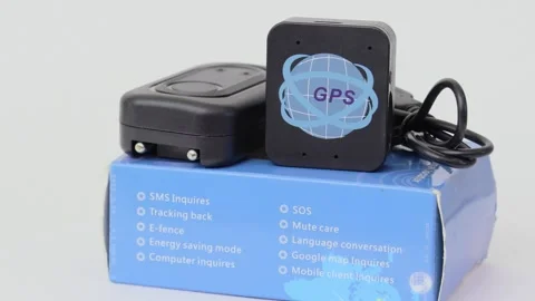 GPS module set on blue box, rotates isolated on white Stock Footage 276375882