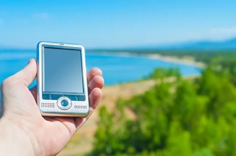 GPS navigation device in hand Stock Photos