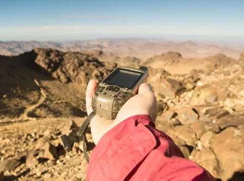 GPS navigator in hand Stock Photos