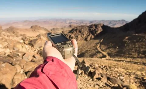 GPS navigator in hand Stock Photos