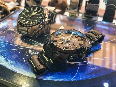 GPS solar man watch Seiko Astron on display Stock Photos