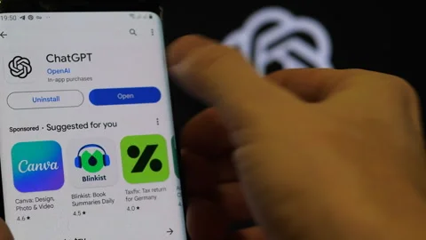 GPT Chat applications are launched on a smartphone. Open AI company logo. A.. Stock Footage 262719496