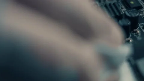 GPU Graphic card. Macro view of technician's hand cleaning the dirt of the chip Video stock 145777344